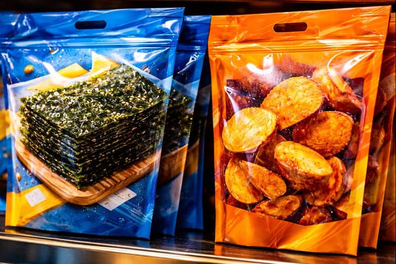 Packaged roasted seaweed and sweet potatoes snacks close-up